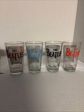 The Beatles Colored Logo Pint Glass Set - Red, Blue, Black, Brown